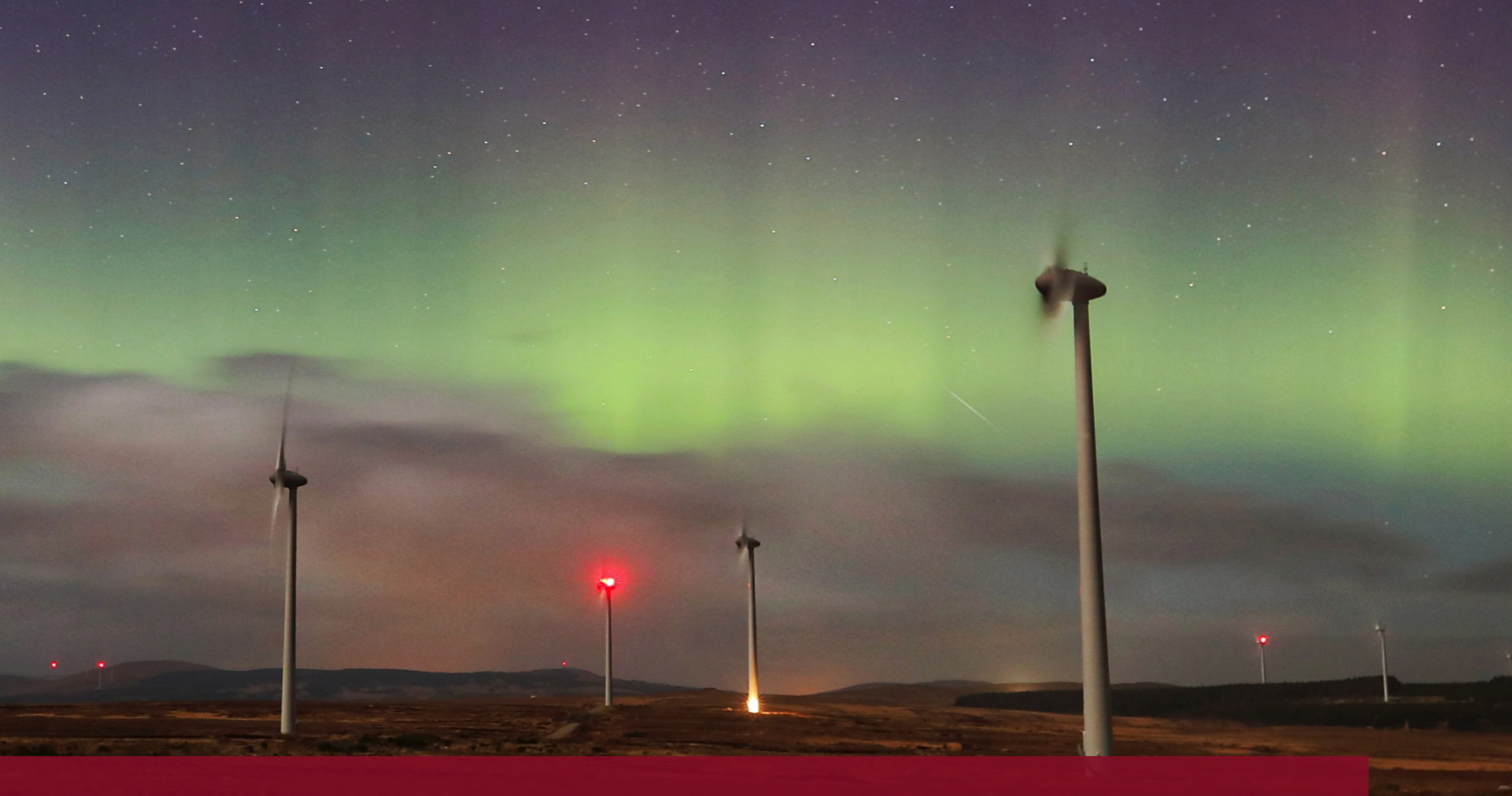 Image of windmills against the aurora lights